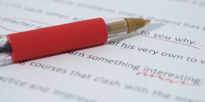 Corrections made with red pen on a draft