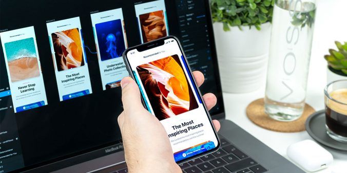 User testing image designs on smartphone.