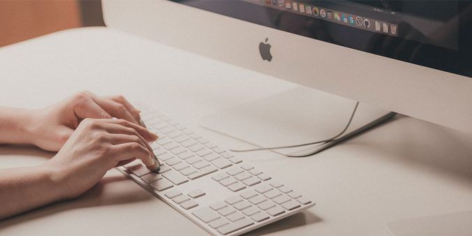 Hands typing on keyboard