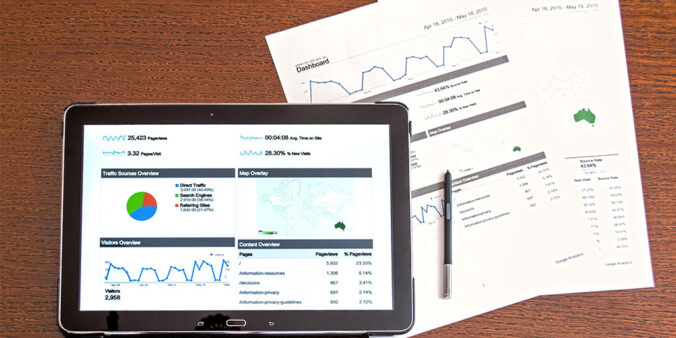 Tablet and paper with analytical data.