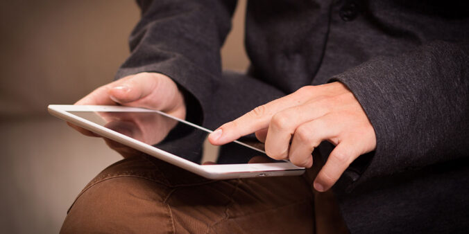 hands on touchscreen tablet